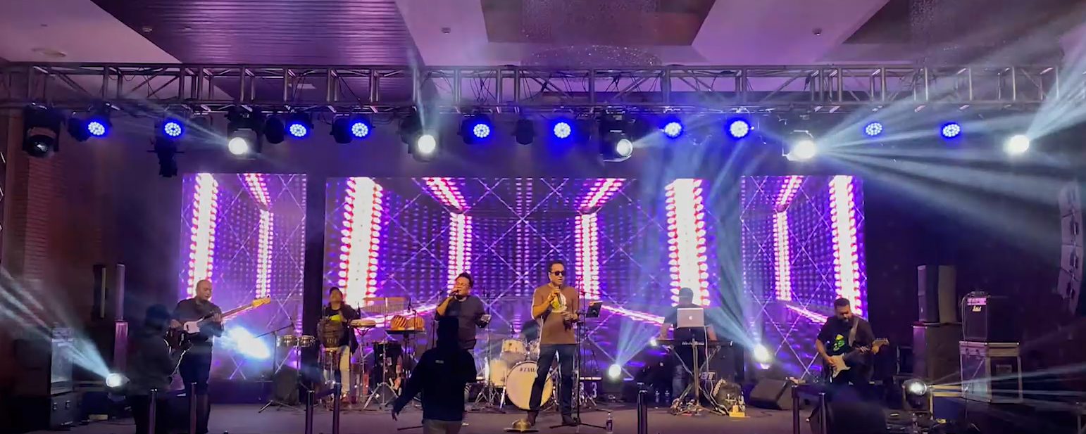 High-energy brand activation event with crowd and stage lighting